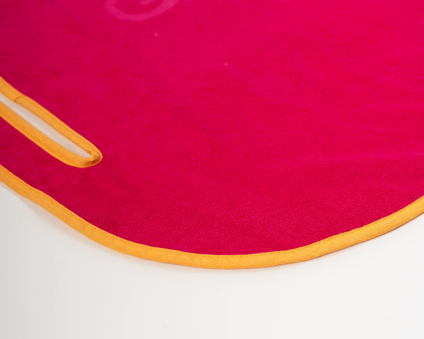 Close up detail of Grove + Green's signature 100% terry cloth golf cart seat towel with orange trim.