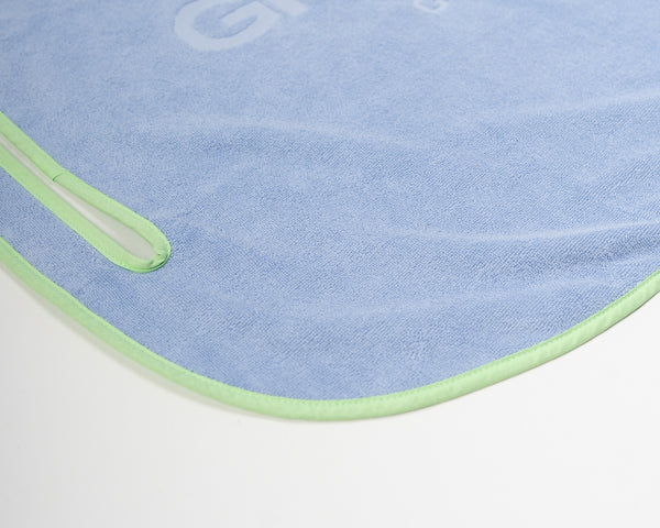 Close up detail of Grove + Green's signature 100% terry cloth golf cart seat towel with green trim.