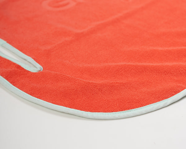 Close up detail of Grove + Green's signature 100% terry cloth golf cart seat towel with light blue trim.