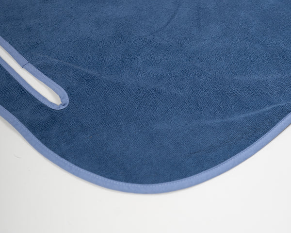 Close up detail of Grove + Green's signature 100% terry cloth golf cart seat towel with classic blue trim.