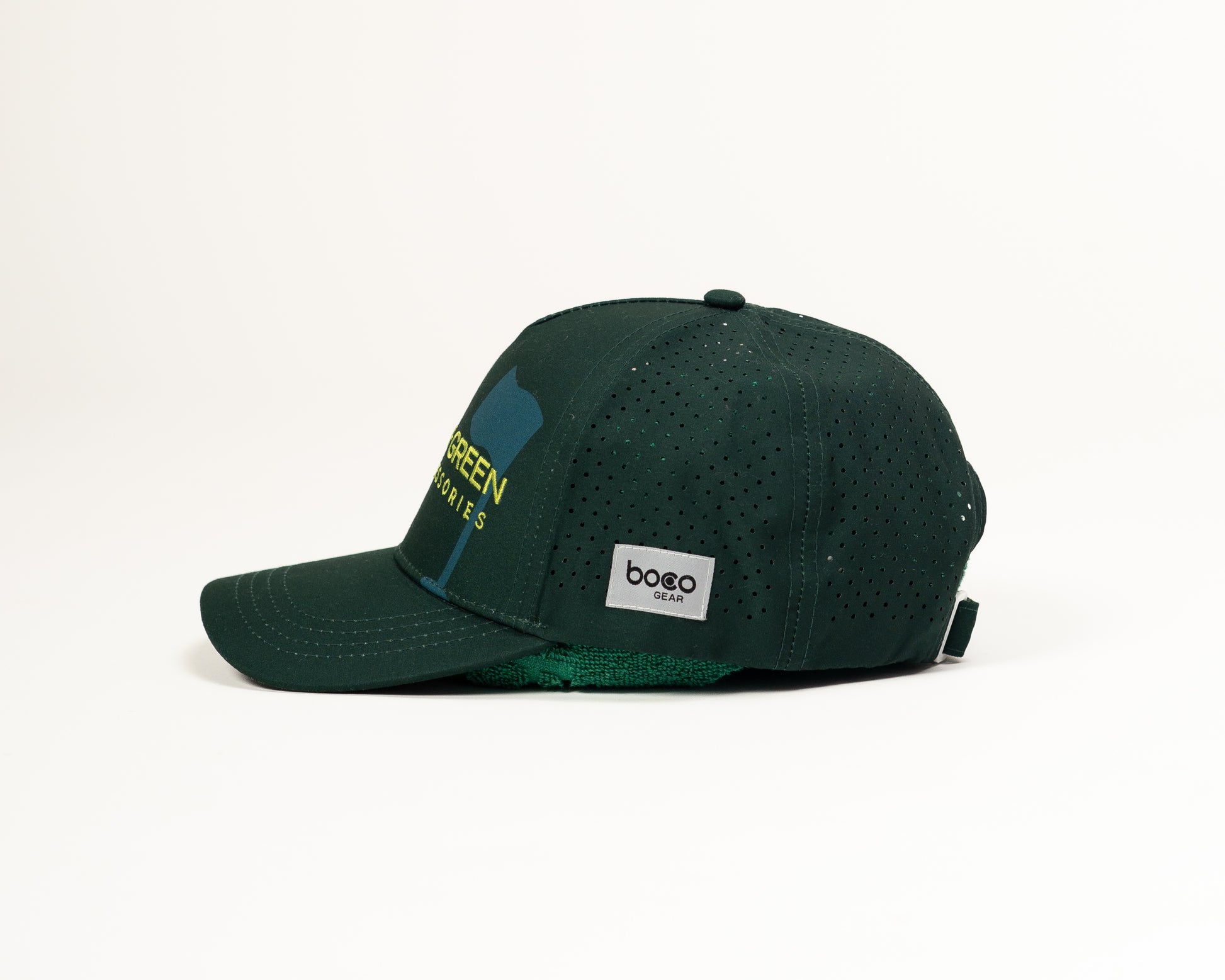 Side profile of the Grove + Green Pursuit Hat showing the structured 5-panel design and the BOCO Gear performance maker's mark.