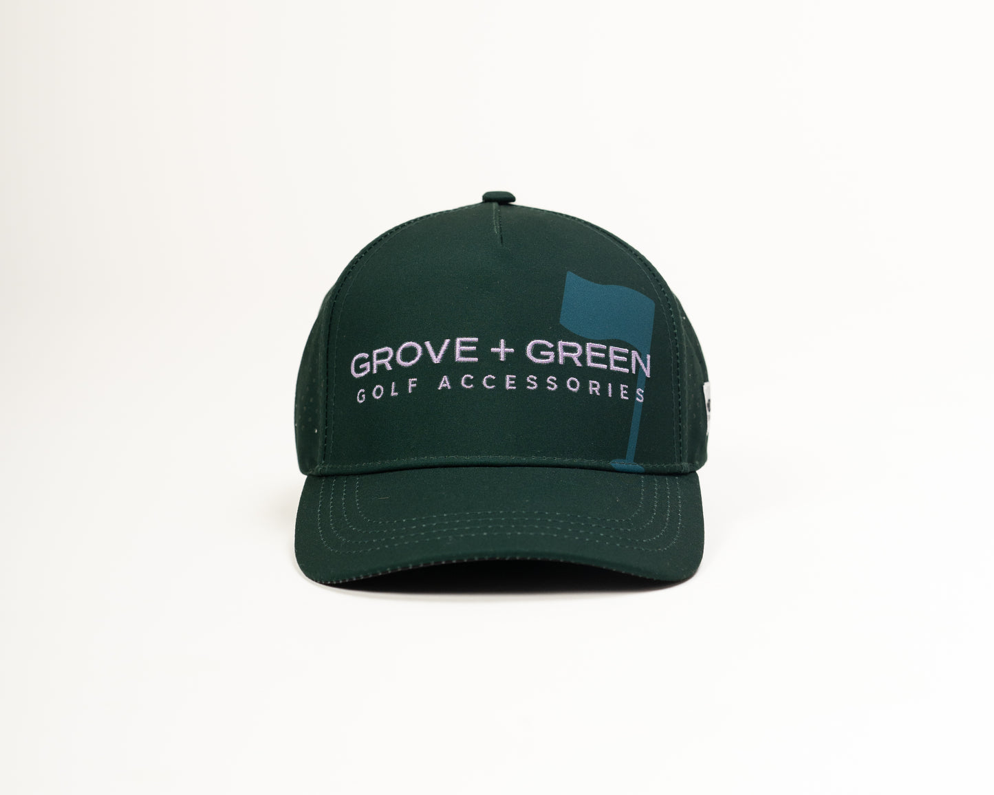 Front view of The Pursuit Hat in lilac featuring the embroidered Grove + Green logo and a classic curved brim.