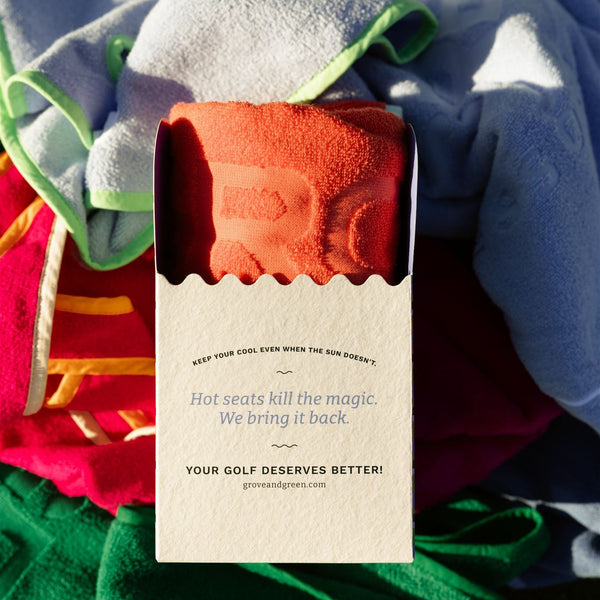 Grove + Green 100% terry cloth golf cart seat towel packaging on top of five colours.