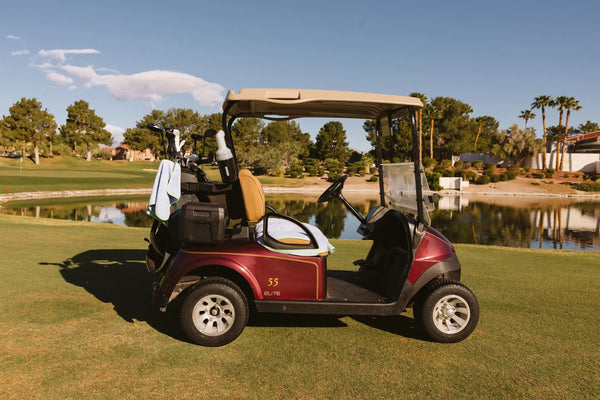 Burgundy golf cart with Grove + Green signature 100% terry cloth golf cart seat cover in light blue periwinkle.