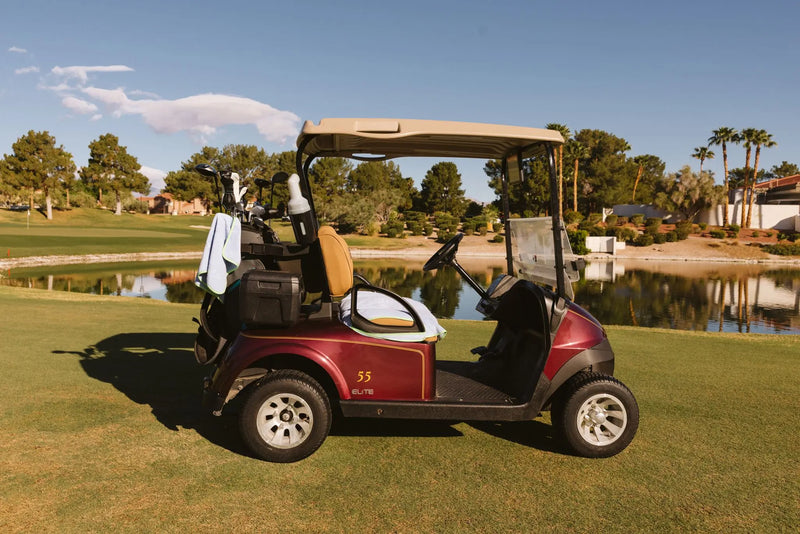 Burgundy golf cart with Grove + Green signature 100% terry cloth golf cart seat cover in light blue periwinkle.