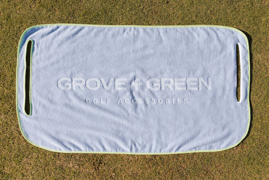 Grove + Green light blue periwinkle 100% terry cloth golf cart seat towel with green trim.