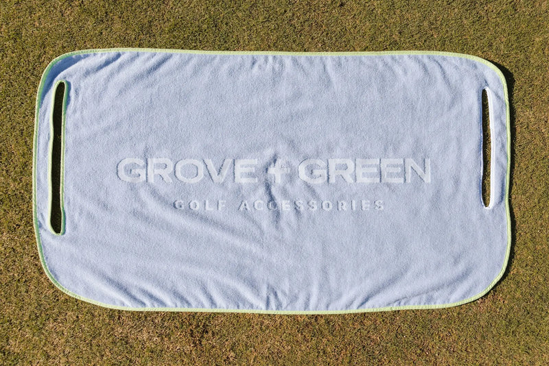 Grove + Green light blue periwinkle 100% terry cloth golf cart seat towel with green trim.